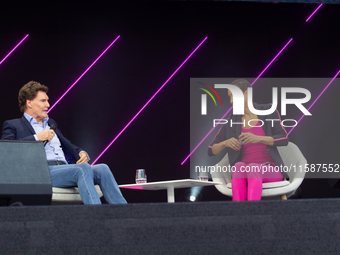 Carsten Maschmeyer, an international startup investor, and Annabelle Mandeng, a German actress, speak at Media Park on the second day of Deu...