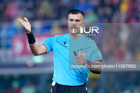 Referee Rohit Saggi gestures during the UEFA Champions League 2024/25 League Phase MD1 match between Bologna FC and FC Shakhtar Donetsk at S...