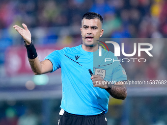 Referee Rohit Saggi gestures during the UEFA Champions League 2024/25 League Phase MD1 match between Bologna FC and FC Shakhtar Donetsk at S...