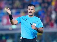 Referee Rohit Saggi gestures during the UEFA Champions League 2024/25 League Phase MD1 match between Bologna FC and FC Shakhtar Donetsk at S...