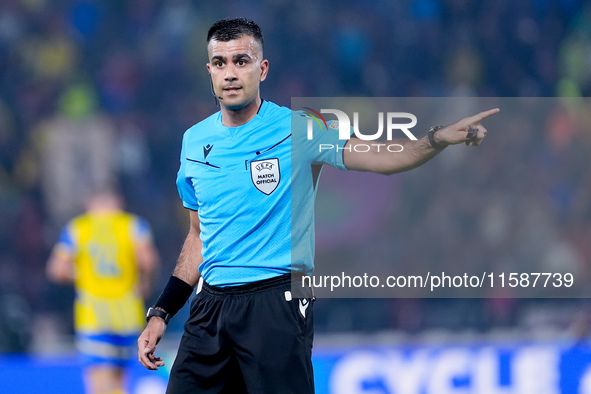 Referee Rohit Soggi gestures during the UEFA Champions League 2024/25 League Phase MD1 match between Bologna FC and FC Shakhtar Donetsk at S...