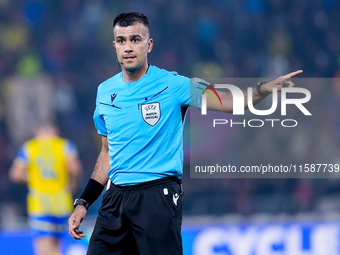 Referee Rohit Soggi gestures during the UEFA Champions League 2024/25 League Phase MD1 match between Bologna FC and FC Shakhtar Donetsk at S...