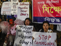 Protesters hold placards during the protest in Dhaka, Bangladesh, on September 19, 2024, against Bengali settler attacks on the Indigenous c...