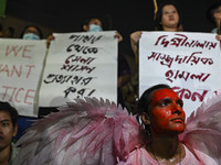 Protesters hold placards during the protest in Dhaka, Bangladesh, on September 19, 2024, against Bengali settler attacks on the Indigenous c...