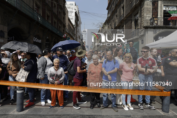 A group of people observes a National Drill 2024 in Mexico City, Mexico, on September 19, 2024, to evaluate and correct responses to possibl...