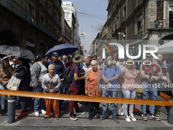 A group of people observes a National Drill 2024 in Mexico City, Mexico, on September 19, 2024, to evaluate and correct responses to possibl...