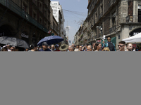 A group of people observes a National Drill 2024 in Mexico City, Mexico, on September 19, 2024, to evaluate and correct responses to possibl...