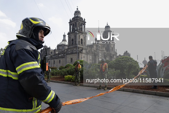 Members of the Heroic Fire Brigade participate in the National Drill 2024 in Mexico City, Mexico, on September 19, 2024, to evaluate and cor...