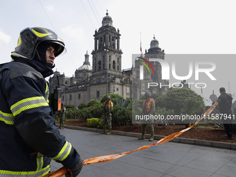 Members of the Heroic Fire Brigade participate in the National Drill 2024 in Mexico City, Mexico, on September 19, 2024, to evaluate and cor...