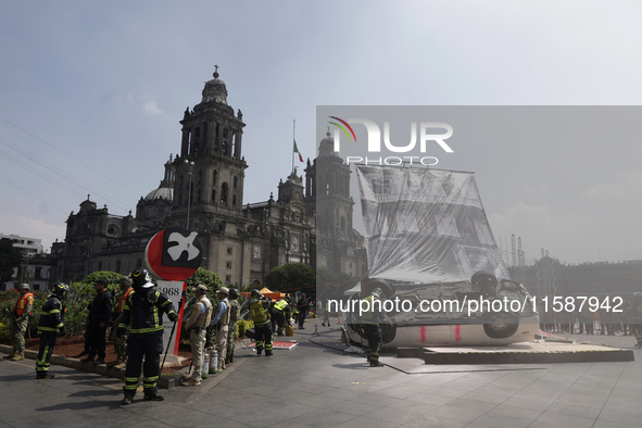 Members of the Heroic Fire Brigade participate in the National Drill 2024 in Mexico City, Mexico, on September 19, 2024, to evaluate and cor...