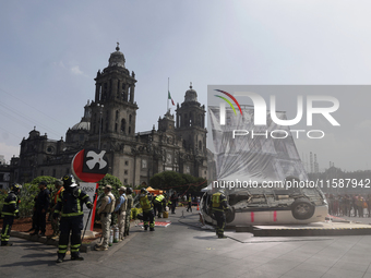 Members of the Heroic Fire Brigade participate in the National Drill 2024 in Mexico City, Mexico, on September 19, 2024, to evaluate and cor...