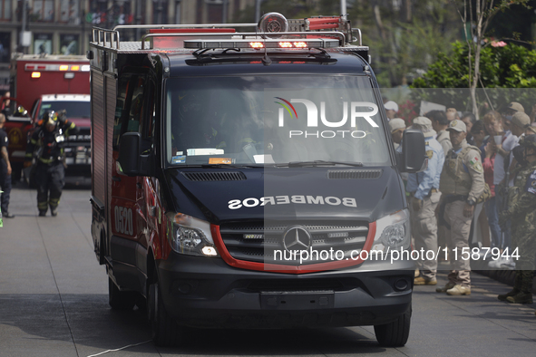 Members of the Heroic Fire Brigade participate in the National Drill 2024 in Mexico City, Mexico, on September 19, 2024, to evaluate and cor...