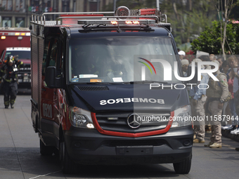 Members of the Heroic Fire Brigade participate in the National Drill 2024 in Mexico City, Mexico, on September 19, 2024, to evaluate and cor...