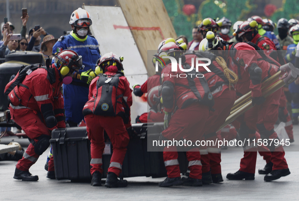 Members of the Secretary of the Navy participate in the National Drill 2024 in the Zocalo of Mexico City, Mexico, on September 19, 2024, to...