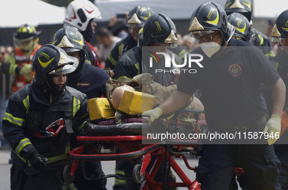 Members of the Heroic Fire Brigade participate in the National Drill 2024 in Mexico City, Mexico, on September 19, 2024, to evaluate and cor...