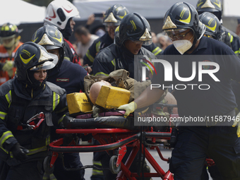 Members of the Heroic Fire Brigade participate in the National Drill 2024 in Mexico City, Mexico, on September 19, 2024, to evaluate and cor...