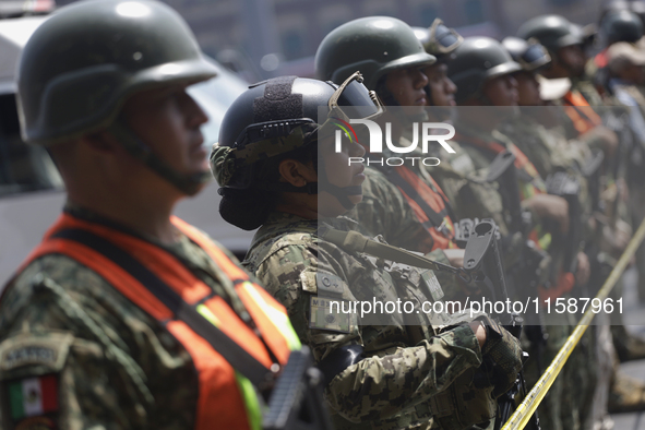 Members of the Mexican army guard the area during the National Drill 2024 in the Zocalo of Mexico City, Mexico, on September 19, 2024, to ev...