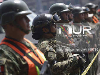 Members of the Mexican army guard the area during the National Drill 2024 in the Zocalo of Mexico City, Mexico, on September 19, 2024, to ev...