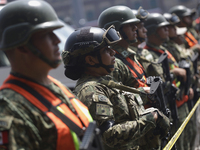 Members of the Mexican army guard the area during the National Drill 2024 in the Zocalo of Mexico City, Mexico, on September 19, 2024, to ev...