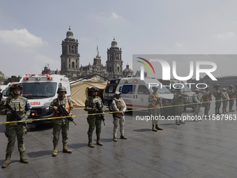 Members of the Mexican army guard the area during the National Drill 2024 in the Zocalo of Mexico City, Mexico, on September 19, 2024, to ev...