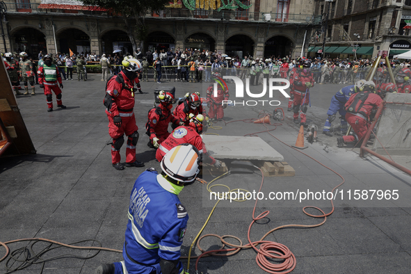 Members of the Secretary of the Navy participate in the National Drill 2024 in the Zocalo of Mexico City, Mexico, on September 19, 2024, to...