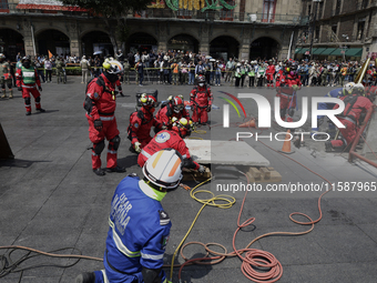 Members of the Secretary of the Navy participate in the National Drill 2024 in the Zocalo of Mexico City, Mexico, on September 19, 2024, to...