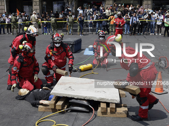 Members of the Secretary of the Navy participate in the National Drill 2024 in the Zocalo of Mexico City, Mexico, on September 19, 2024, to...