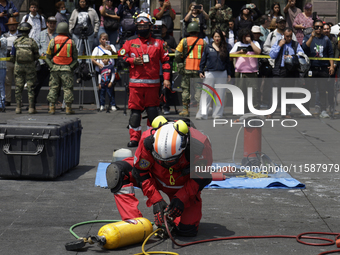 Members of the Secretary of the Navy participate in the National Drill 2024 in the Zocalo of Mexico City, Mexico, on September 19, 2024, to...