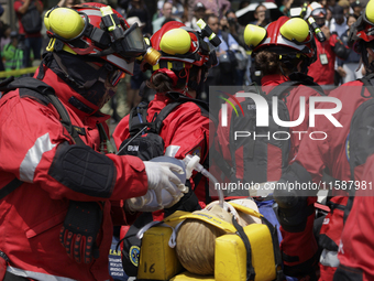 Members of the Secretary of the Navy participate in the National Drill 2024 in the Zocalo of Mexico City, Mexico, on September 19, 2024, to...