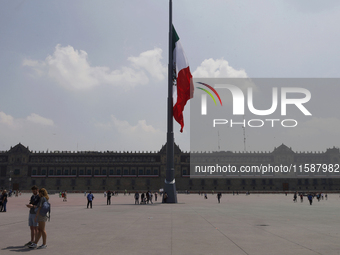 View of Mexico's flag at half-mast in Mexico City, Mexico, on September 19, 2024, during the National Drill 2024 to evaluate and correct res...