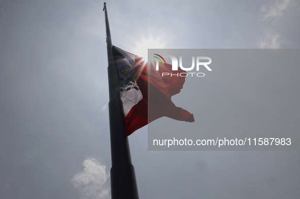 View of Mexico's flag at half-mast in Mexico City, Mexico, on September 19, 2024, during the National Drill 2024 to evaluate and correct res...