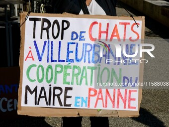 Protesters from the Ron Rhone association stand in front of the Villeurbanne town hall to urge the city's mayor to sterilize stray cats in V...