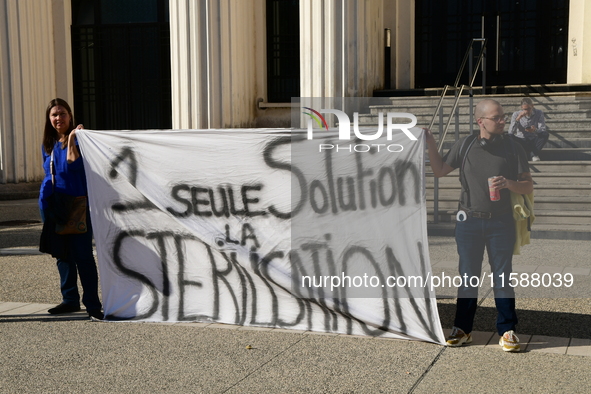 Protesters from the Ron Rhone association stand in front of the Villeurbanne town hall to urge the city's mayor to sterilize stray cats in V...