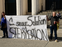 Protesters from the Ron Rhone association stand in front of the Villeurbanne town hall to urge the city's mayor to sterilize stray cats in V...