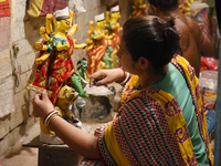 An artisan makes an idol of the Hindu Goddess Durga in Kumartuli, the potter's village in Kolkata, India, on September 20, 2024. The four-da...