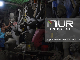 An artisan makes an idol of the Hindu Goddess Durga in Kumartuli, the potter's village in Kolkata, India, on September 20, 2024. The four-da...