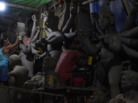 An artisan makes an idol of the Hindu Goddess Durga in Kumartuli, the potter's village in Kolkata, India, on September 20, 2024. The four-da...