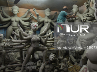 An artisan makes an idol of the Hindu Goddess Durga in Kumartuli, the potter's village in Kolkata, India, on September 20, 2024. The four-da...