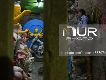 An artisan makes an idol of the Hindu Goddess Durga in Kumartuli, the potter's village in Kolkata, India, on September 20, 2024. The four-da...