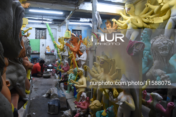 An artisan makes an idol of the Hindu Goddess Durga in Kumartuli, the potter's village in Kolkata, India, on September 20, 2024. The four-da...