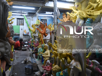 An artisan makes an idol of the Hindu Goddess Durga in Kumartuli, the potter's village in Kolkata, India, on September 20, 2024. The four-da...