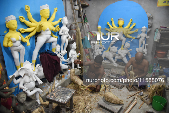 An artisan makes an idol of the Hindu Goddess Durga in Kumartuli, the potter's village in Kolkata, India, on September 20, 2024. The four-da...