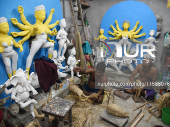 An artisan makes an idol of the Hindu Goddess Durga in Kumartuli, the potter's village in Kolkata, India, on September 20, 2024. The four-da...