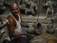 An artisan makes an idol of the Hindu Goddess Durga in Kumartuli, the potter's village in Kolkata, India, on September 20, 2024. The four-da...