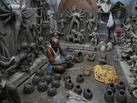 An artisan makes an idol of the Hindu Goddess Durga in Kumartuli, the potter's village in Kolkata, India, on September 20, 2024. The four-da...