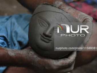 An artisan makes an idol of the Hindu Goddess Durga in Kumartuli, the potter's village in Kolkata, India, on September 20, 2024. The four-da...