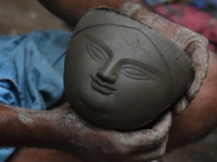 An artisan makes an idol of the Hindu Goddess Durga in Kumartuli, the potter's village in Kolkata, India, on September 20, 2024. The four-da...