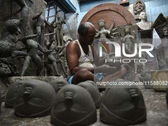 An artisan makes an idol of the Hindu Goddess Durga in Kumartuli, the potter's village in Kolkata, India, on September 20, 2024. The four-da...