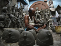 An artisan makes an idol of the Hindu Goddess Durga in Kumartuli, the potter's village in Kolkata, India, on September 20, 2024. The four-da...