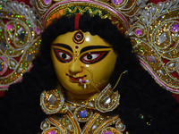 A decoration of the Hindu goddess Durga is displayed on a shelf inside a shop ahead of the Durga Puja festival in Kolkata, India, on Septemb...